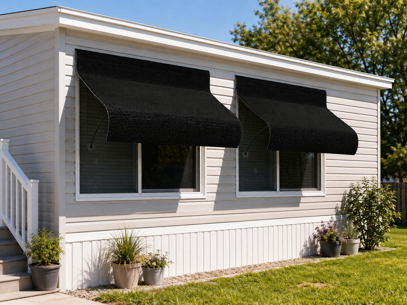 Concept rendering of an UnBeam awning shading a window on a mobile home.
